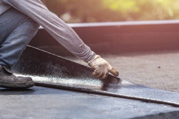 Professional Basement Waterproofing technician working in Laurel, MD